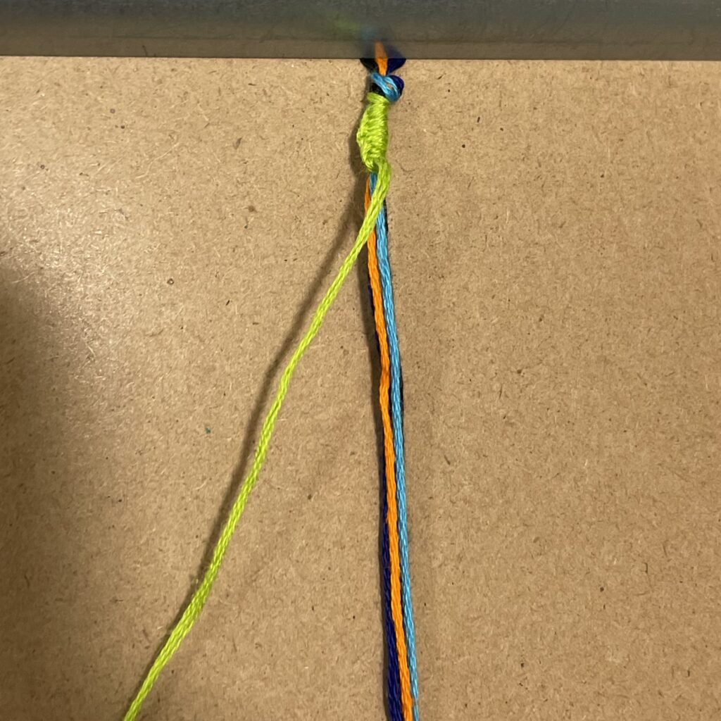 Figure 10. Step 11: Ten completed green left-hand knots.