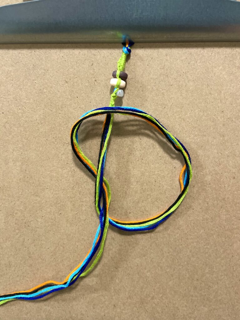 Figure 14: Step 15: Tie a large knot to represent the end of day one.