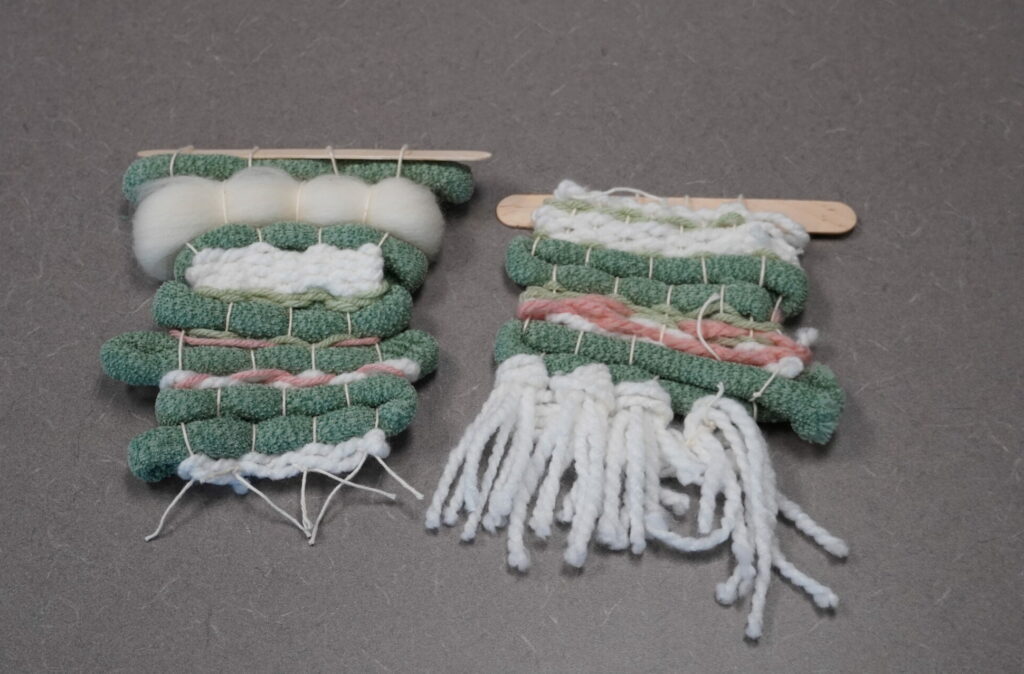 Two separate tapestries representing the CDC website are pictured side-by-side. The one on the left was demonstrated in the step-by-step guide. The one on the right has fringe, larger areas of blush pink, and lacks the roving. 